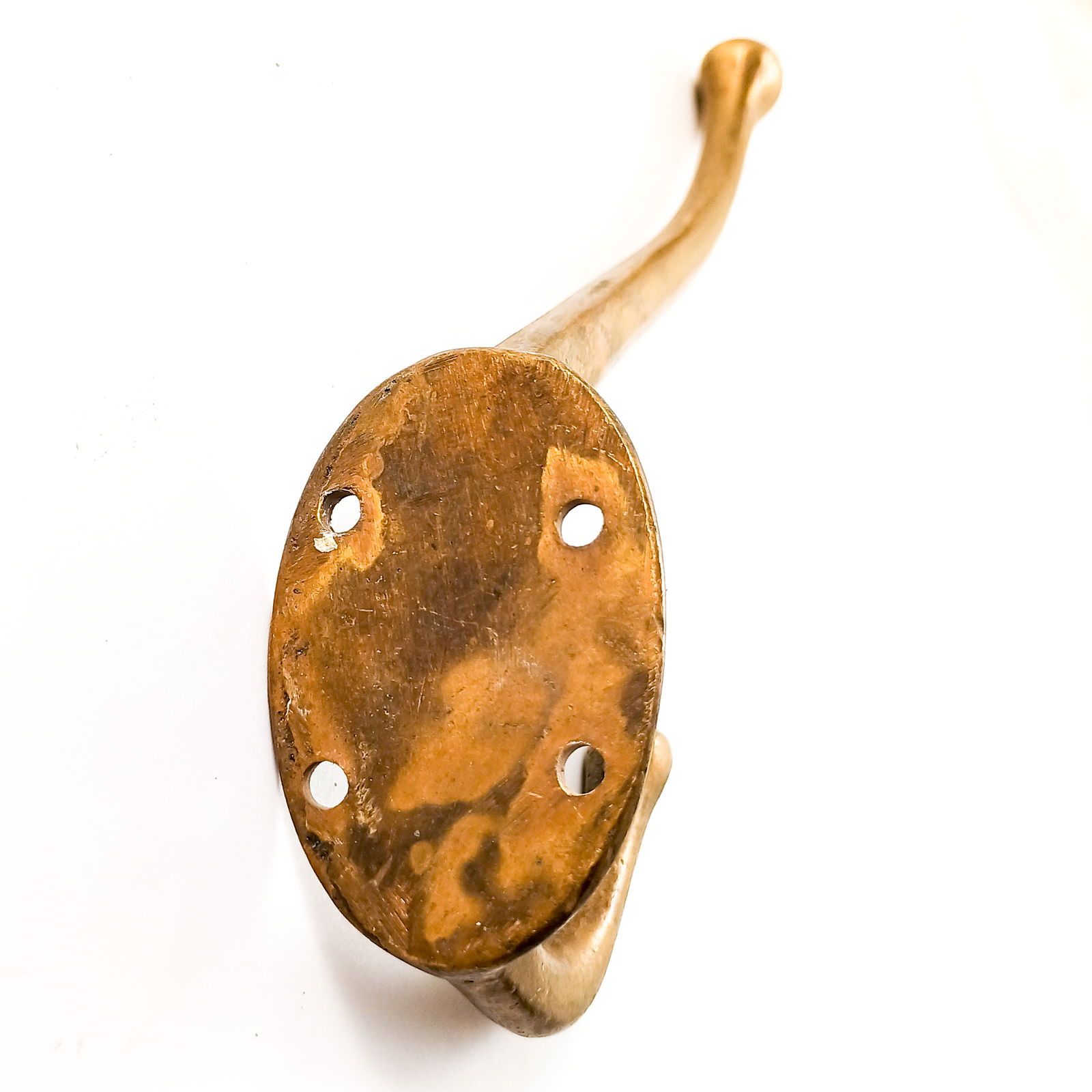 A bronze curved double coat hook, with a fairly long top hook