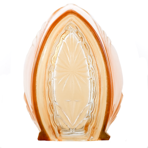 A close-up on a glass slip shade, focused on a clear portion with a starburst design pressed into it, rimmed by orange glass