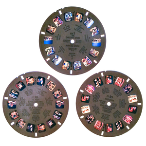 The three Christmas-themed reels placed on a light box, showing that they all have decent color, though the "Rudolph" reel is a little red-tinted