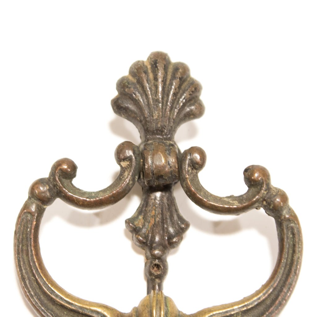 this picture shows the top half of an antique colonial brass ring pull