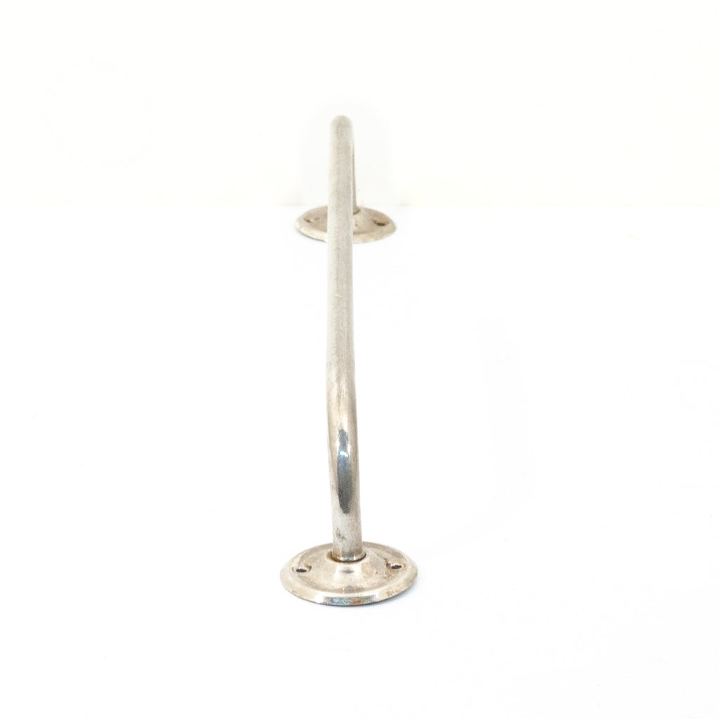 this is a side profile view of a vintage nickel towel bar
