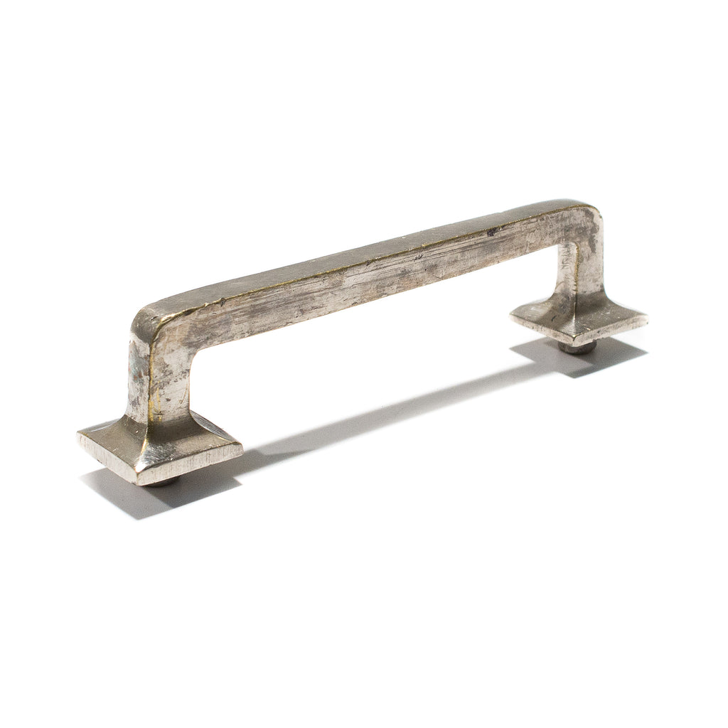 this is a vintage mission style drawer pull in a light silver color