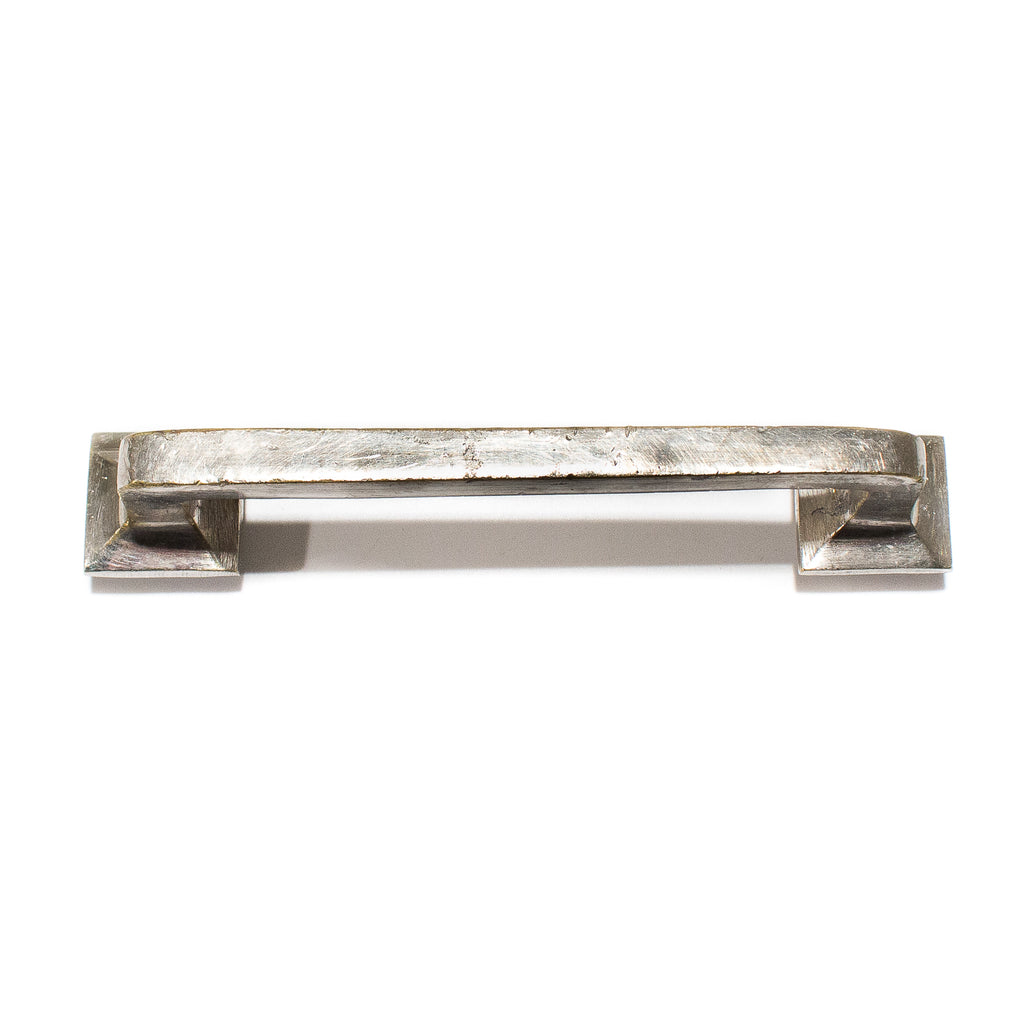 this is a view from the top of a vintage mission style silver colored drawer pull
