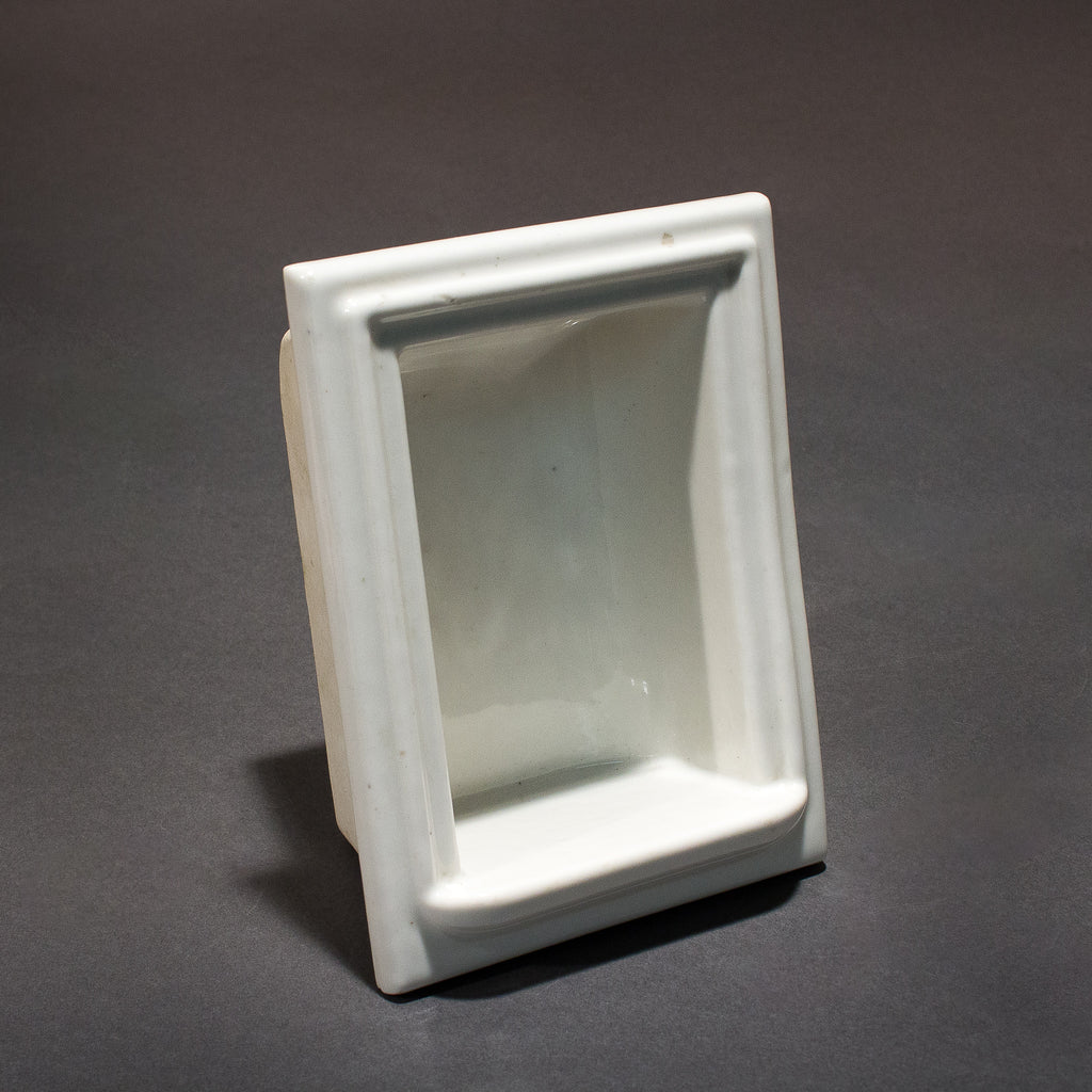 this is an antique vintage white porcelain soap holder for a shower