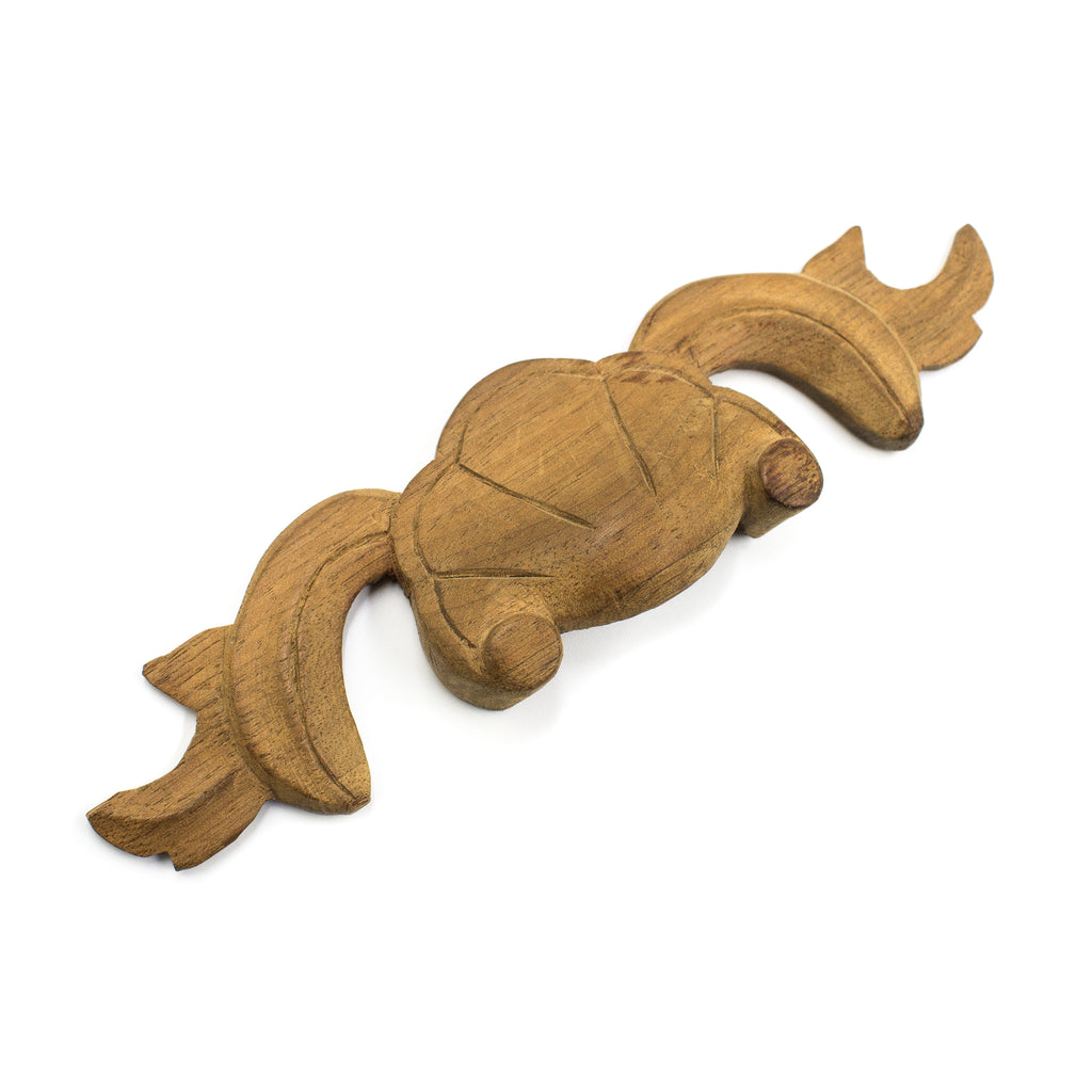 this is a side angle view of an antique vintage carved wood applique