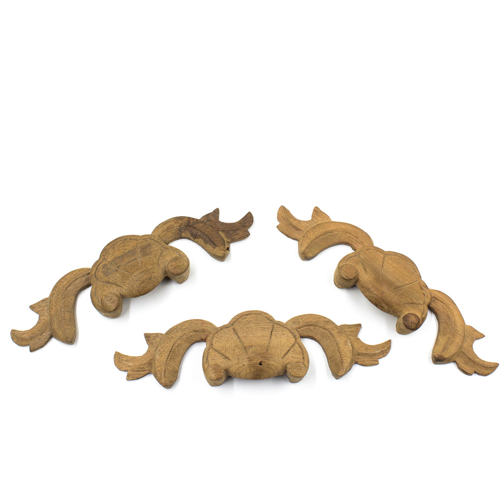 this is a set of three antique vintage carved wood applique pulls for a drawer
