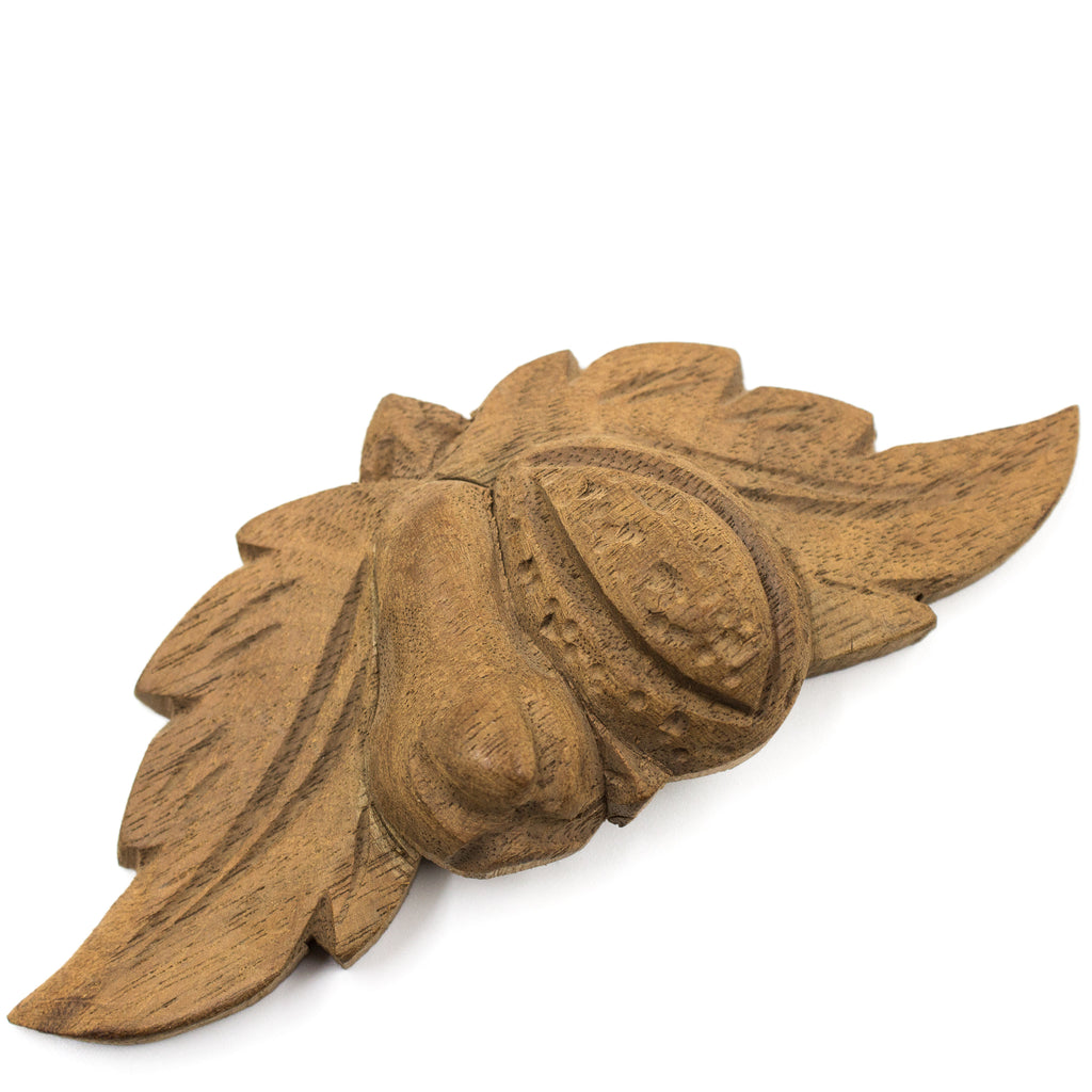 this is a side view of an antique vintage carved wood applique 