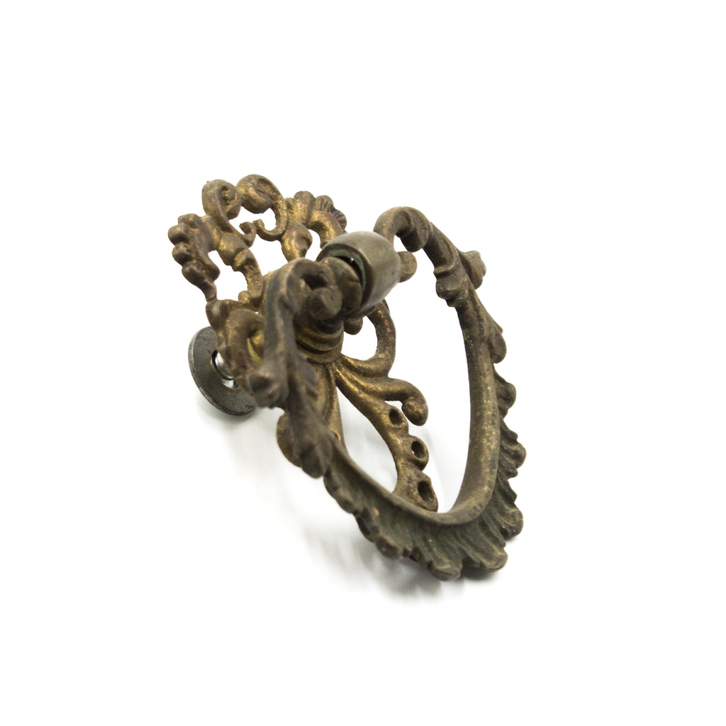 this is the side view of a vintage Victorian brass bail pull for a cabinet or drawer