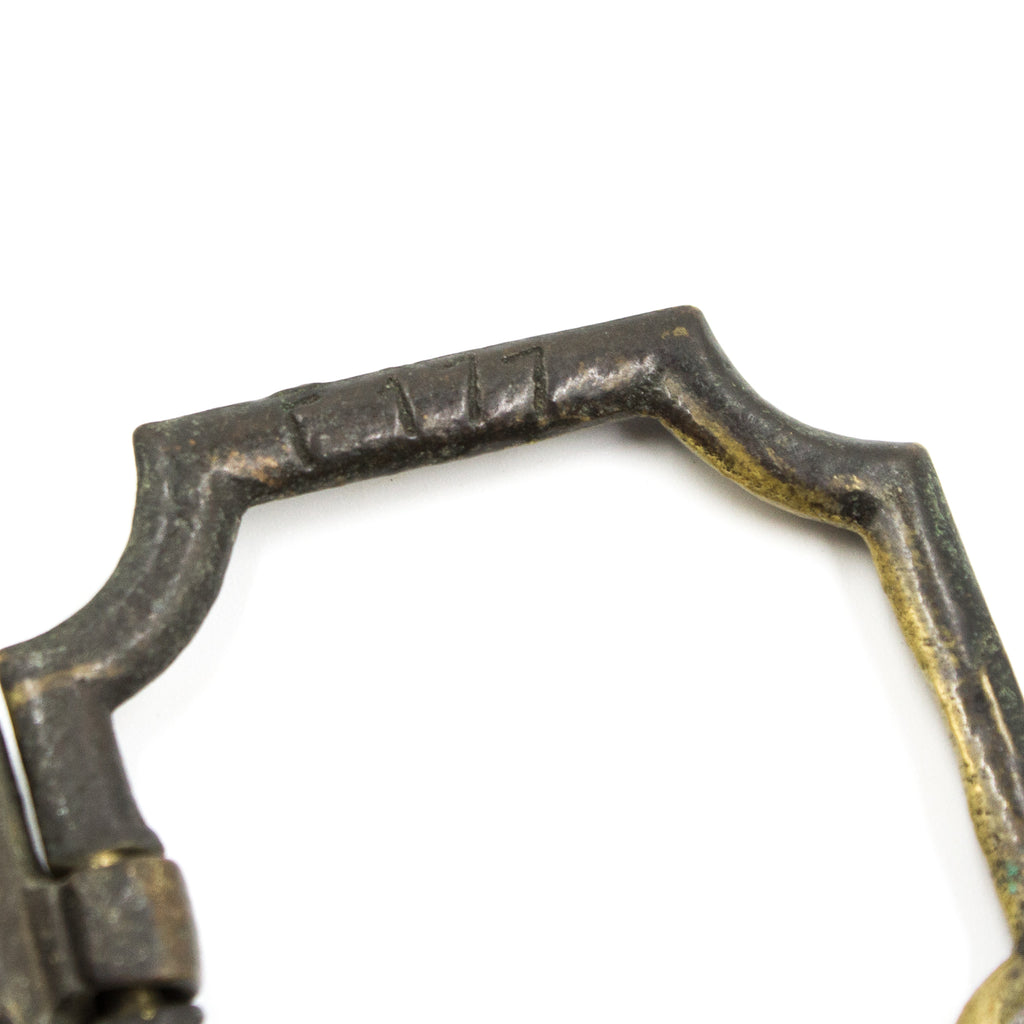 this is an up close picture of an antique vintage ring pull showing the letters and numbers F177 on the side of the ring