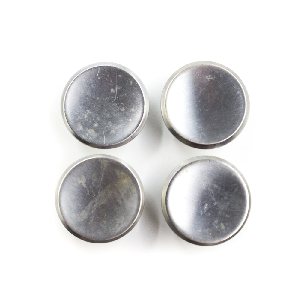 this is a set of four vintage mid century brushed nickel cabinet or drawer pull knobs