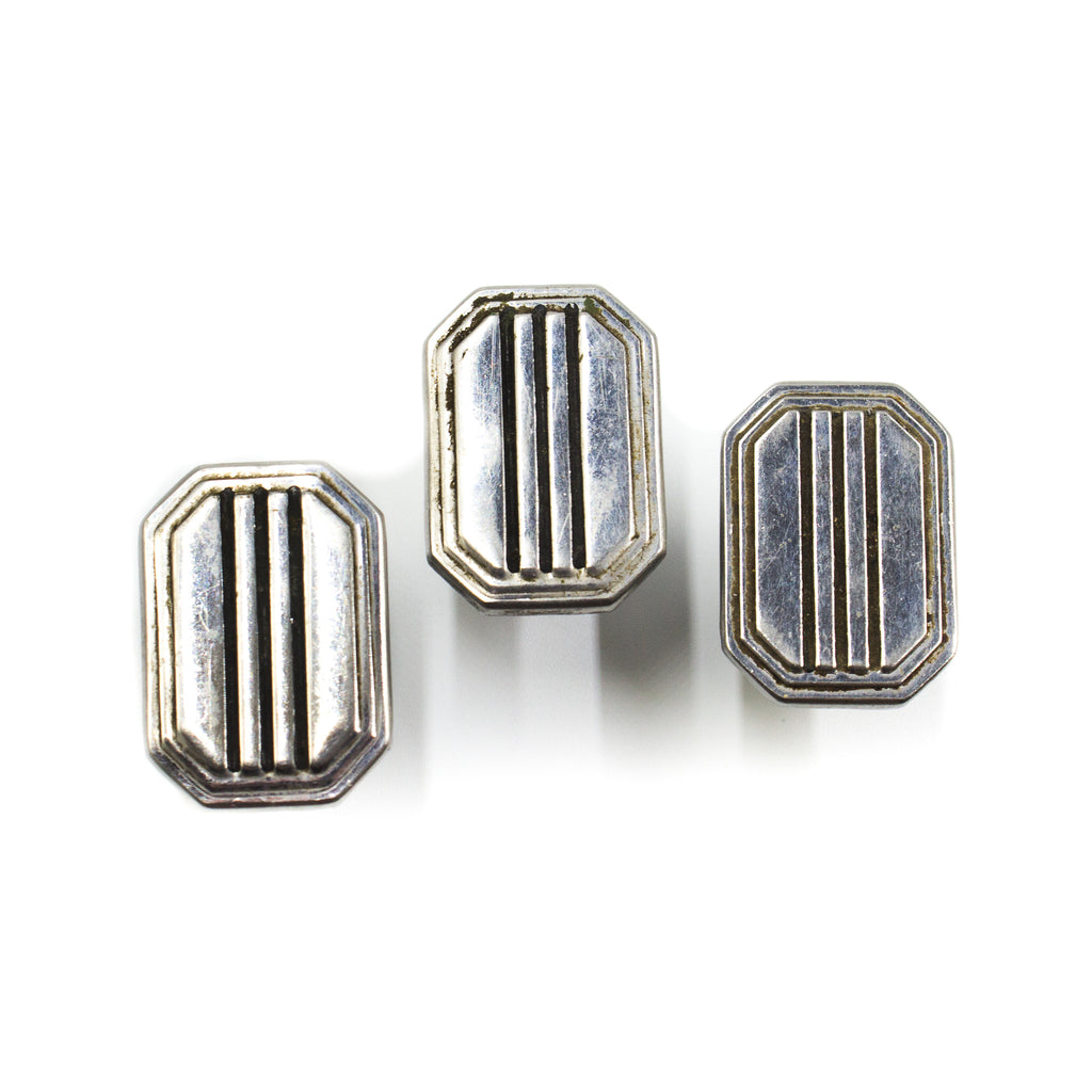 this is a set of three mid century chrome cabinet pull knobs