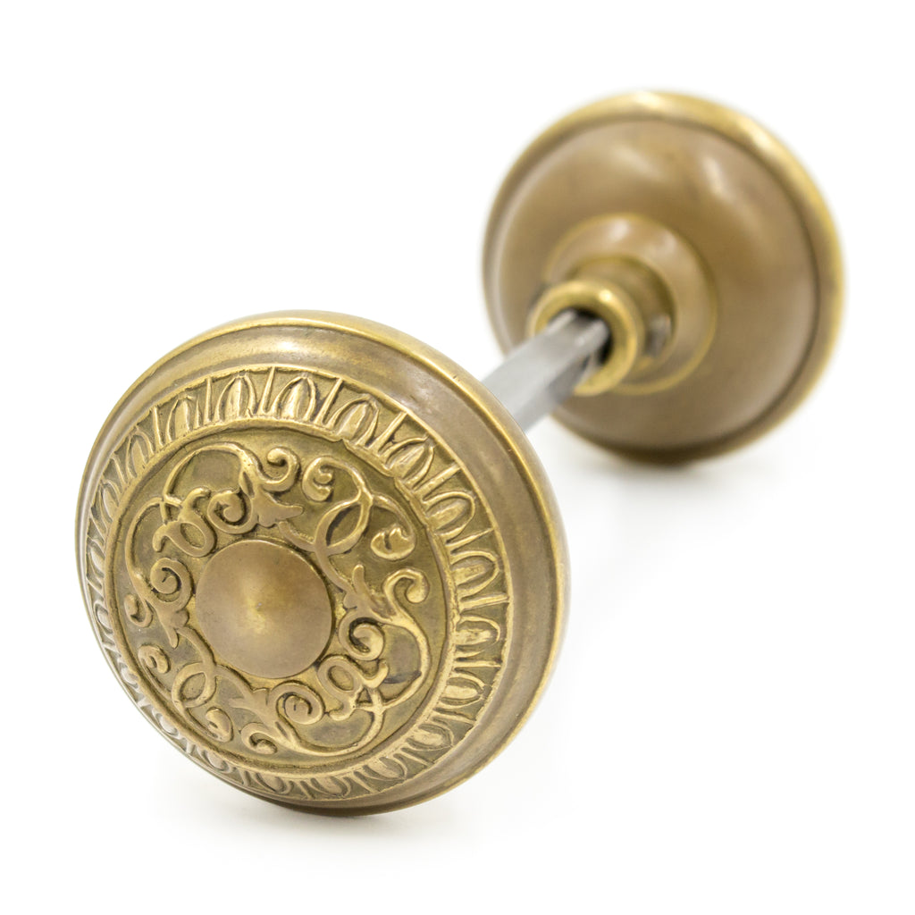 this is reproduction door knob set in a brass color with a Corbin floral design