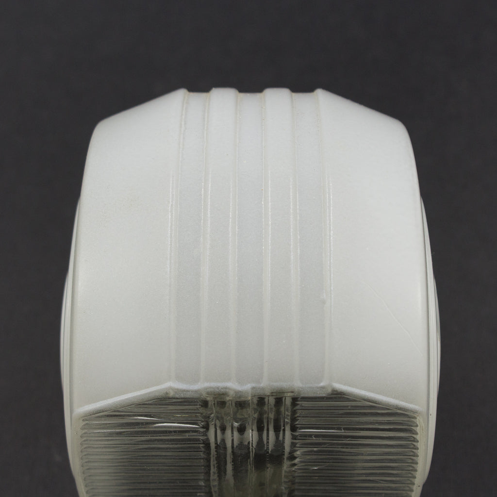 this is a picture of the top of a vintage white glass sconce shade