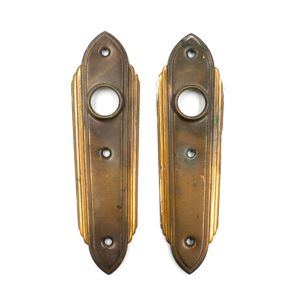 this is a pair of vintage art deco escutcheons
