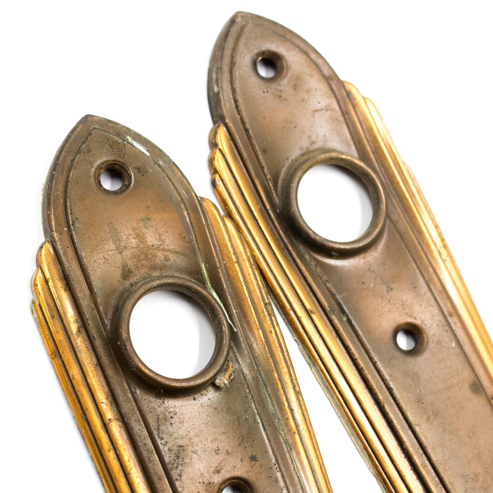 this is a picture of a pair of vintage art deco escutcheons showing minor indentation near where the doorknobs would go 