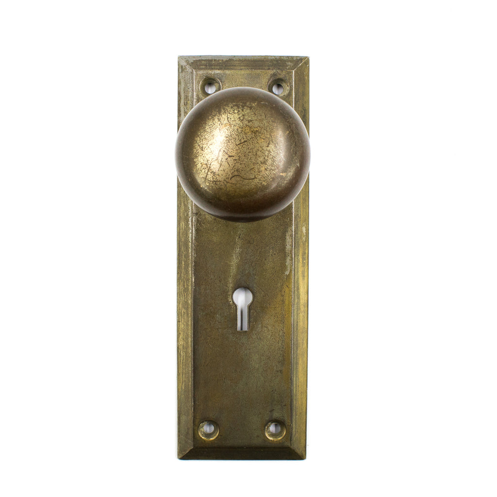 this is a vintage craftsman style door knob set with backplates