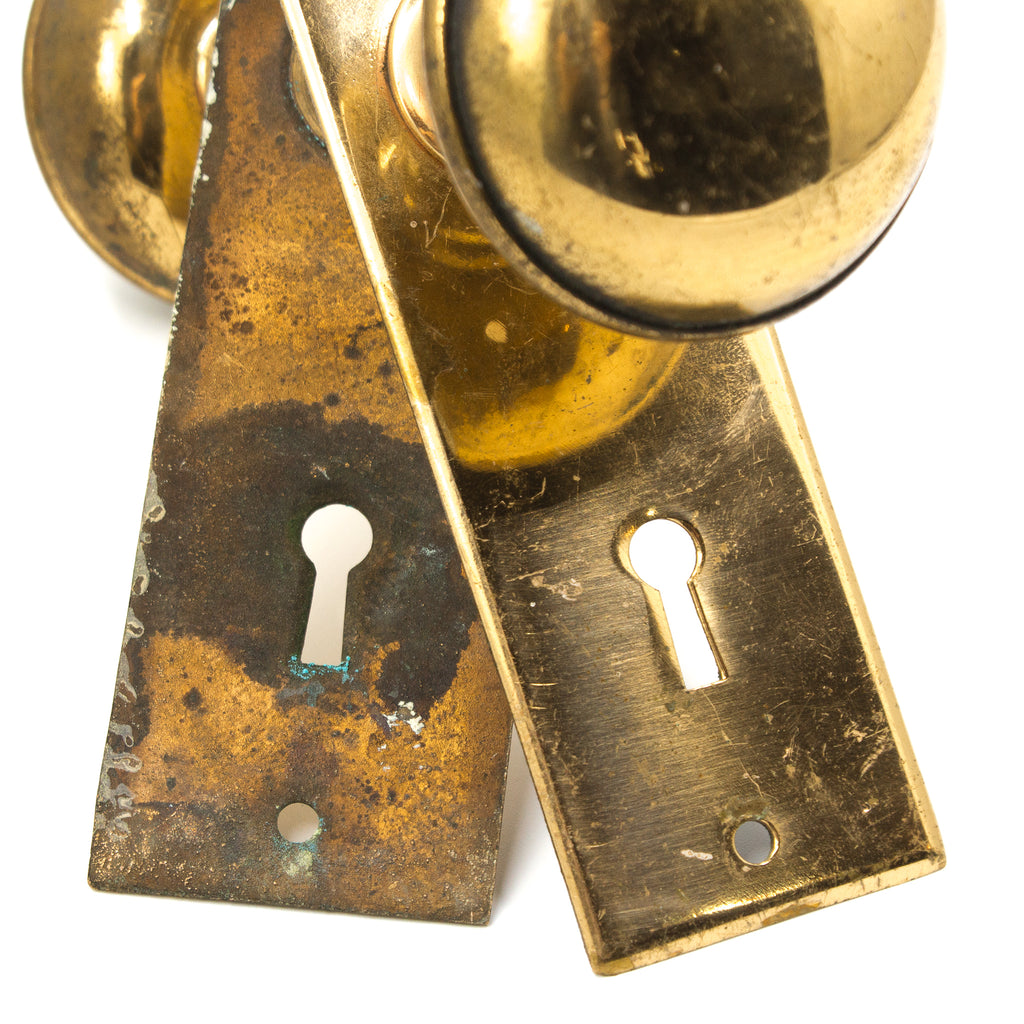 this picture shows the keyholes on a vintage bronze doorknob set