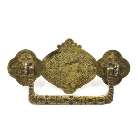 this is an antique vintage brass ornately designed bail pull