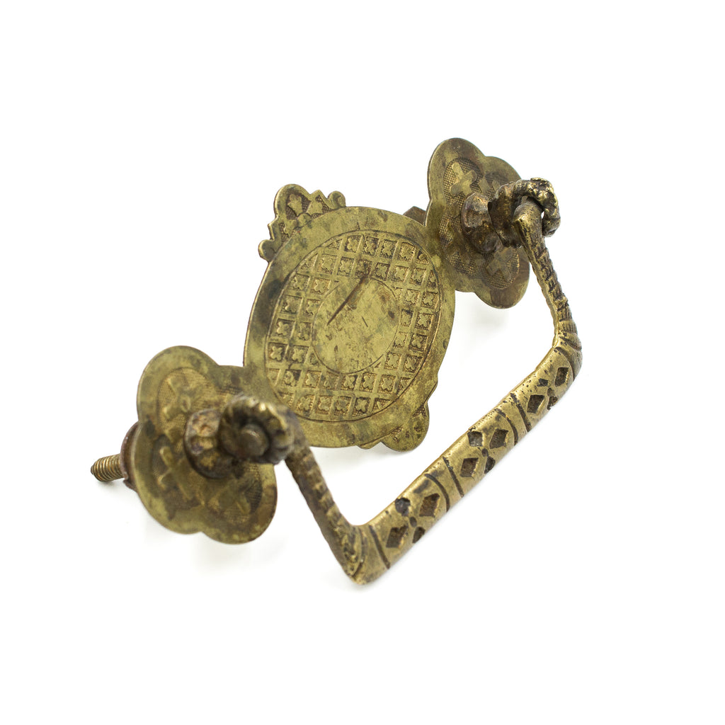 this is a side angle view of an antique brass bail pull