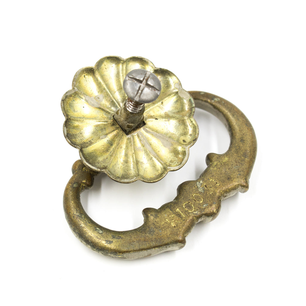 this is a picture of the back of an antique victorian bronze ring pull