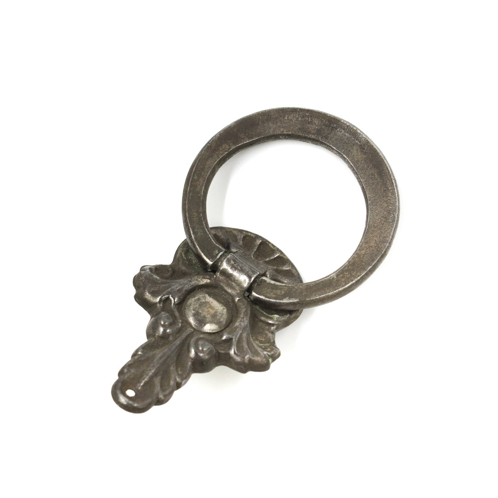 this is the a picture of the back of an antique ring pull