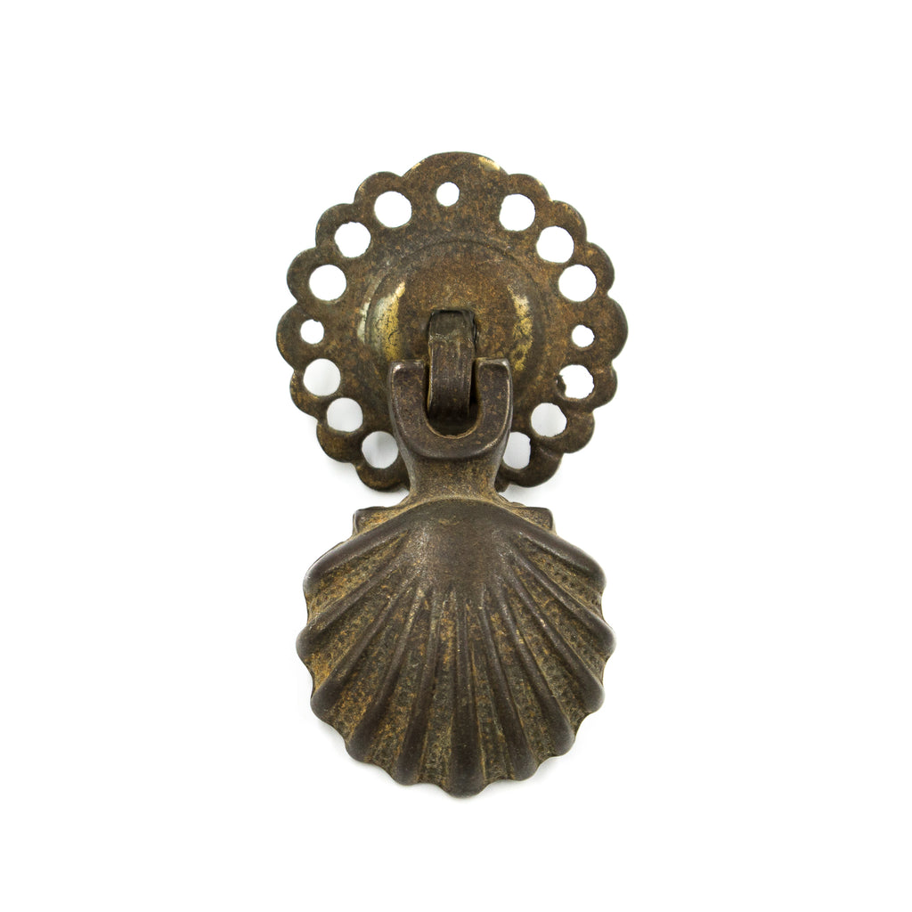 this is an antique drop pull in the shape of a shell