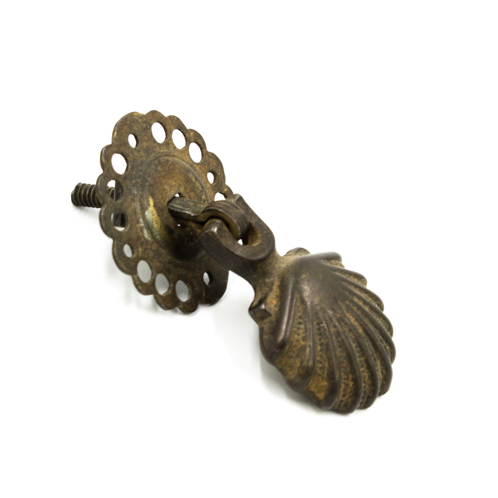 this is a side angle view of an antique drop pull 