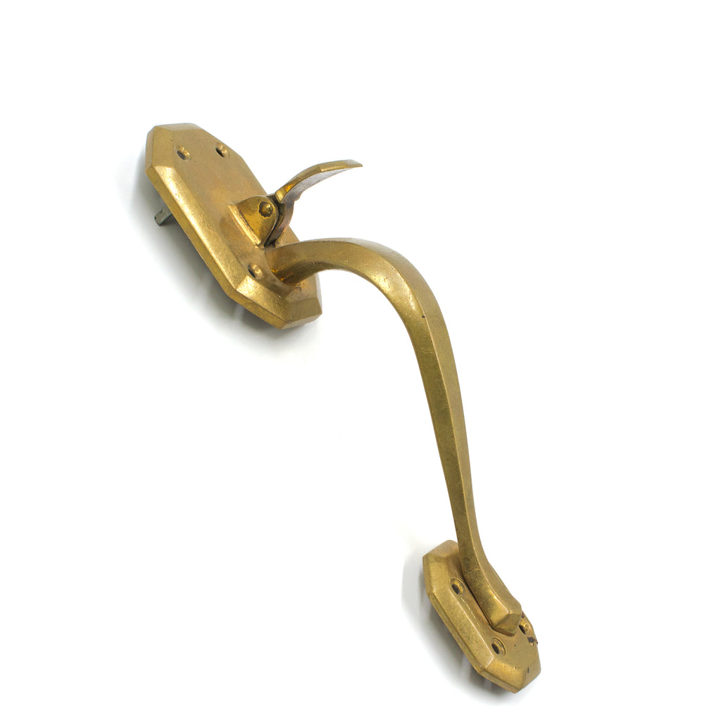 this is a vintage brass art deco pitcher pull for a door