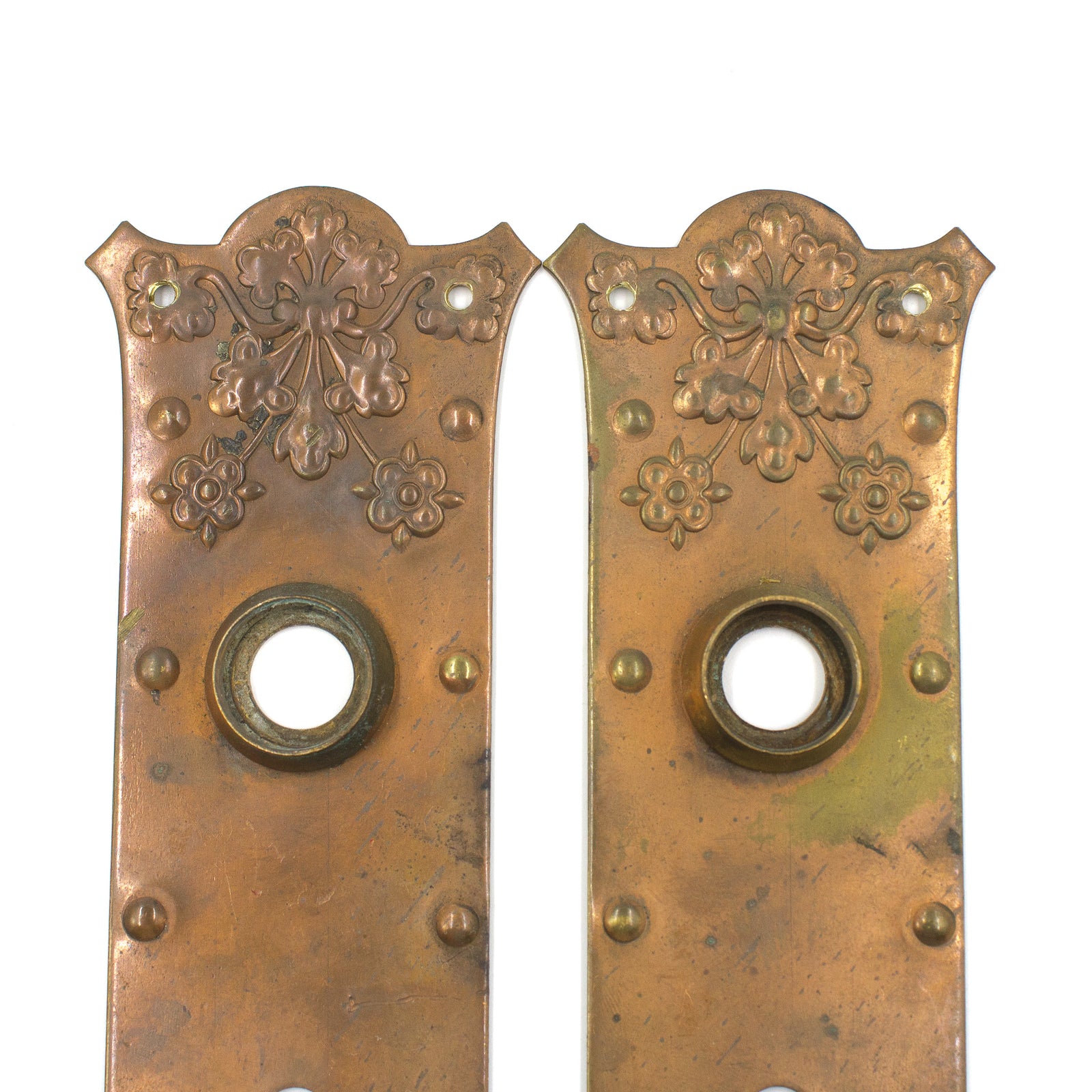this is a pair of vintage floral copper escutcheons