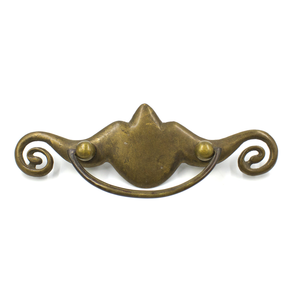 This is a single antique vintage large brass bail pull with a replacement bail