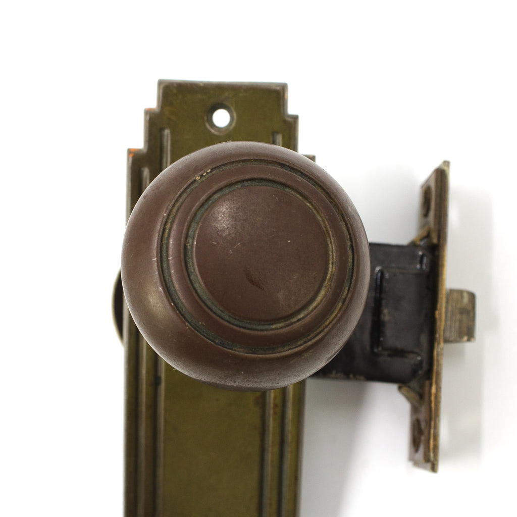 this is a close up picture of the door knob on a vintage art deco entry doorknob set