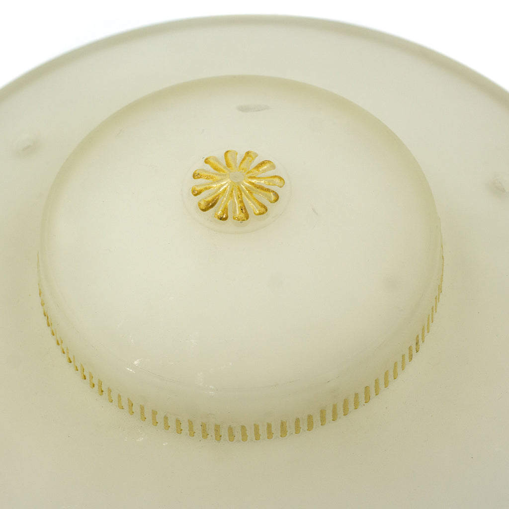 this is a close up picture of the yellow floral detail on a vintage mid century frosted glass three chain shade