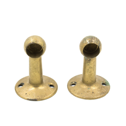 this is a pair of antique vintage brass towel end holders