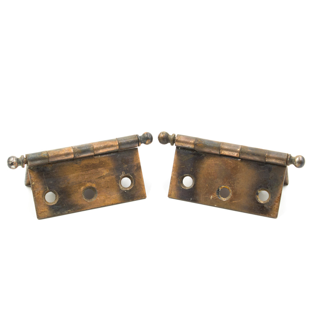 this is a picture of a pair of two vintage copper flash japanned hinges