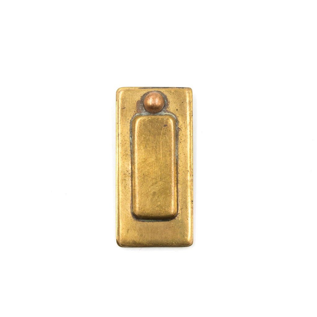this is the front view of an antique vintage bronze keyhole cover showing the cover closed