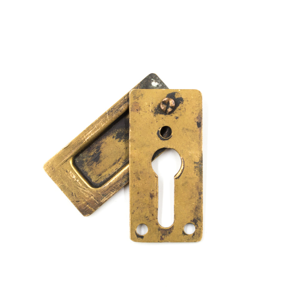 this is the picture of the back of an antique vintage bronze keyhole cover