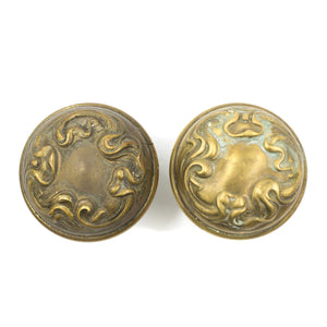 this is a set of two antique art nouveau brass doorknobs