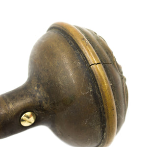 this picture shows a small crack in an antique brass art nouveau doorknob