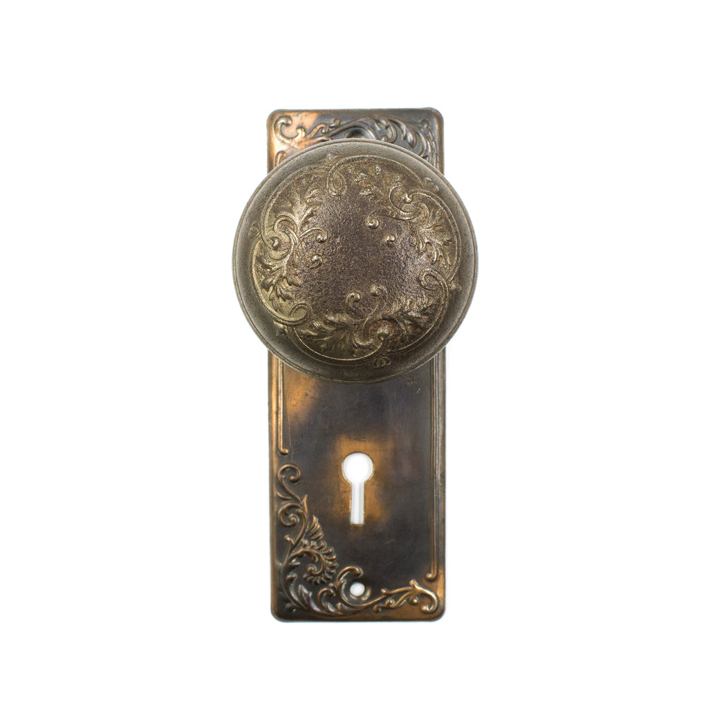 this is an antique Victorian floral doorknob set with backplates