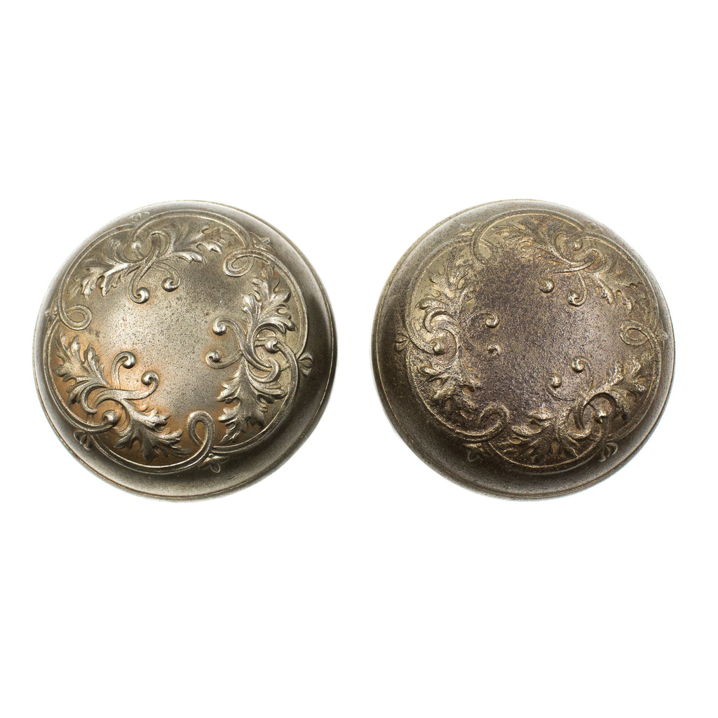 this is a set of two antique Victorian doorknobs showing the floral design and slight wear 