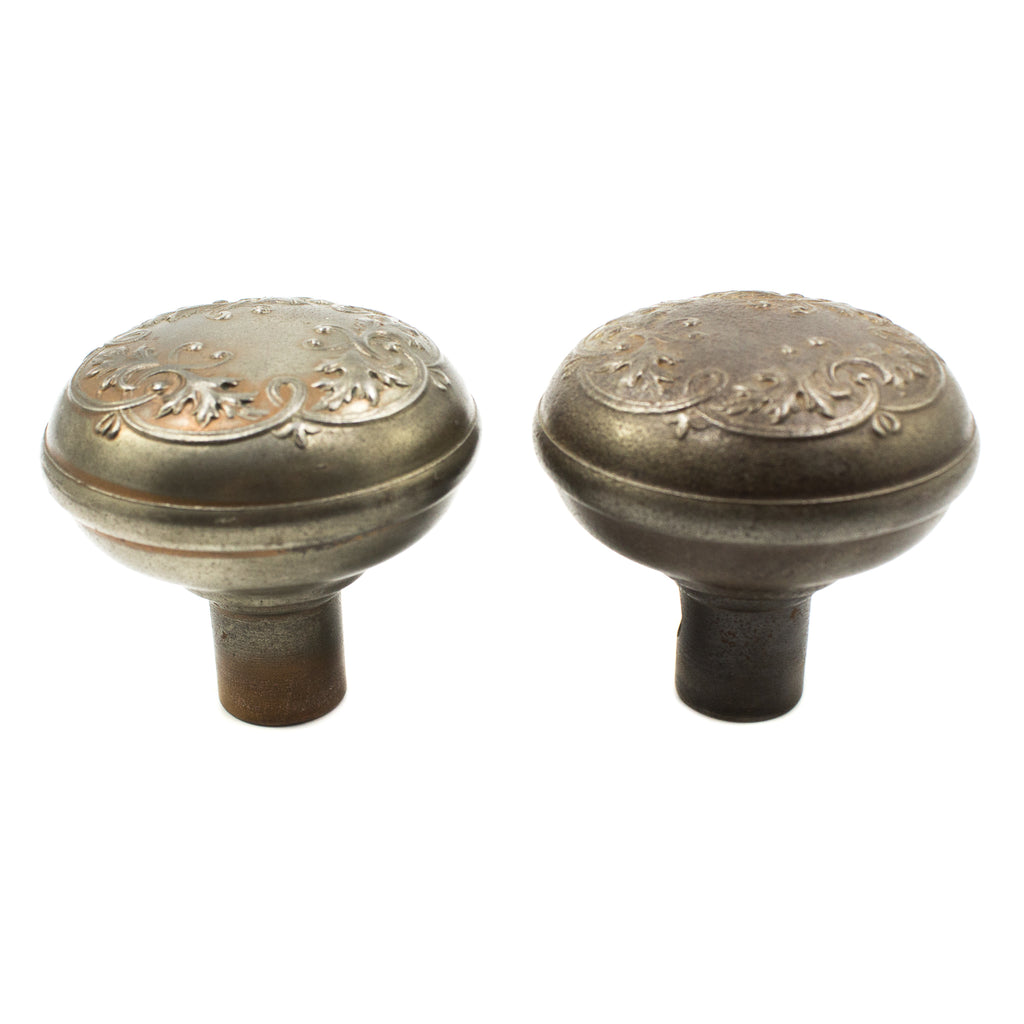 this is a side view of a pair of antique Victorian doorknobs