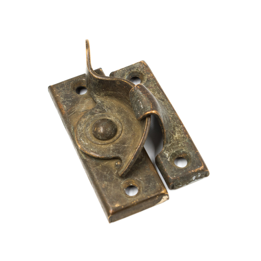 this is an antique stamped sash lock