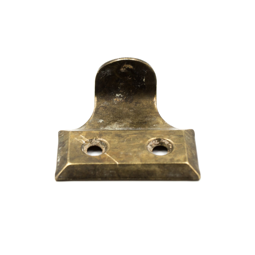 this is an angled view of a vintage brass window lift