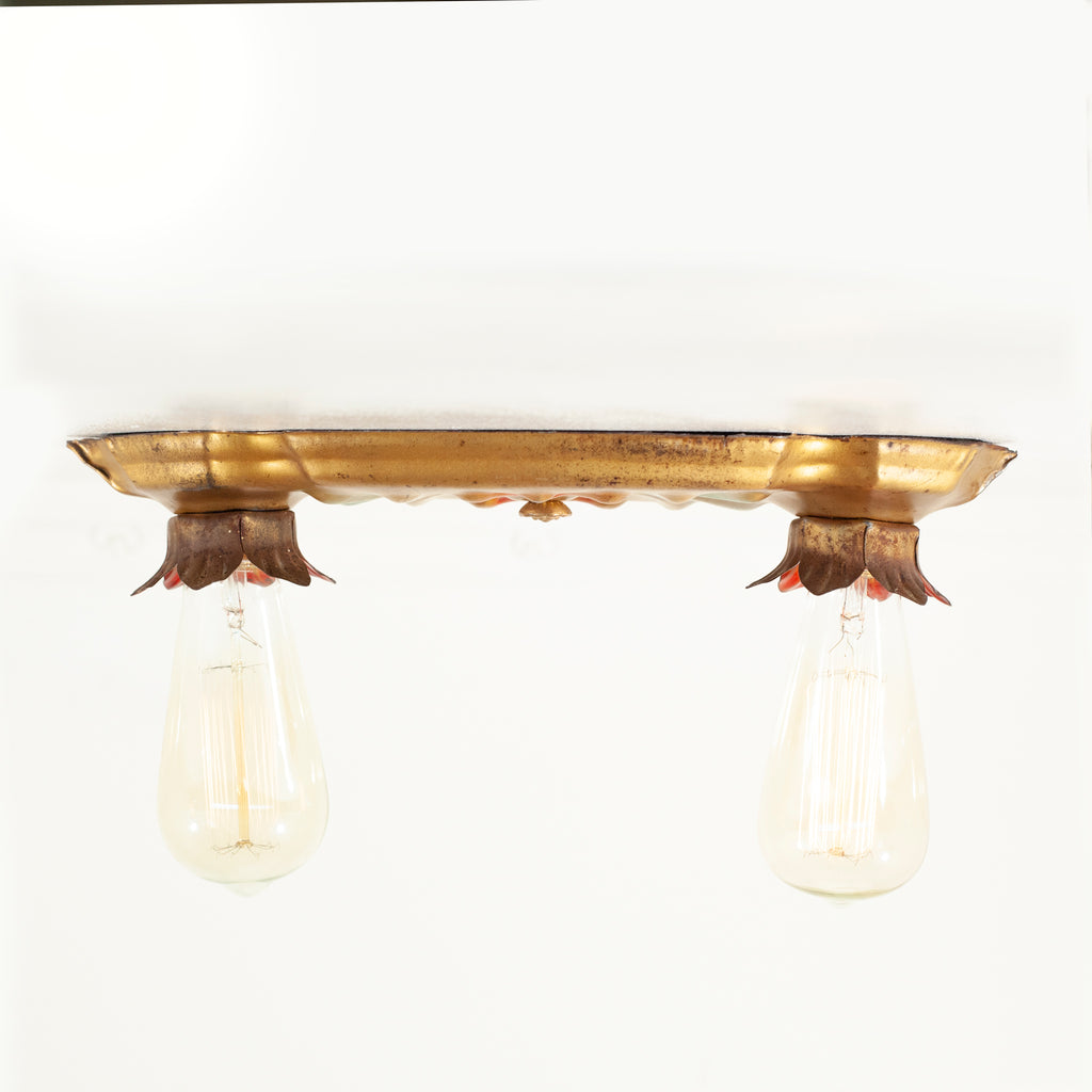 this is a side view of a vintage bare bulb ceiling fixture