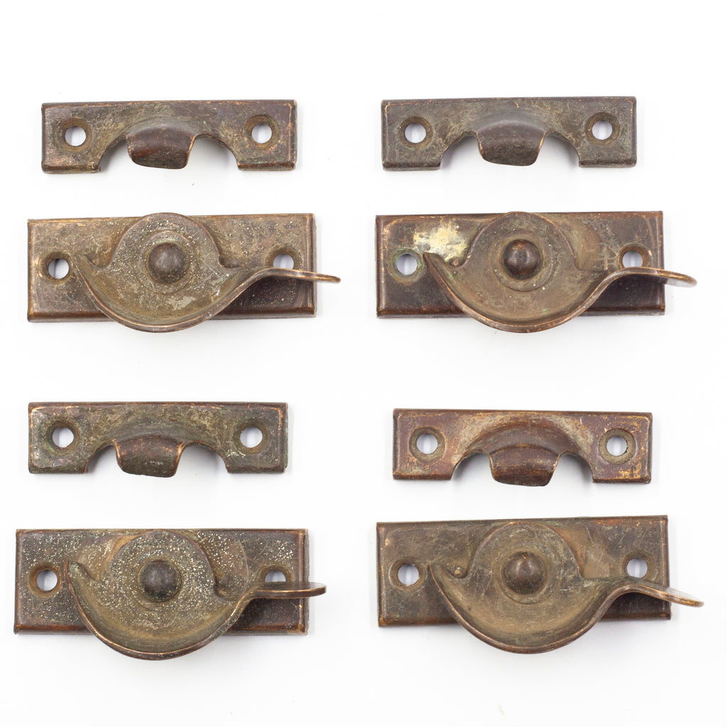 this picture shows a set of four antique sash locks