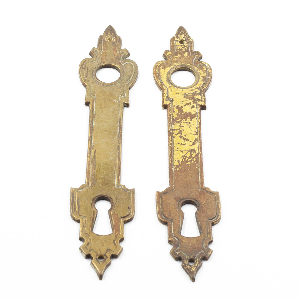 this is a pair of antique vintage brass escutcheons, one has heavy wear on it
