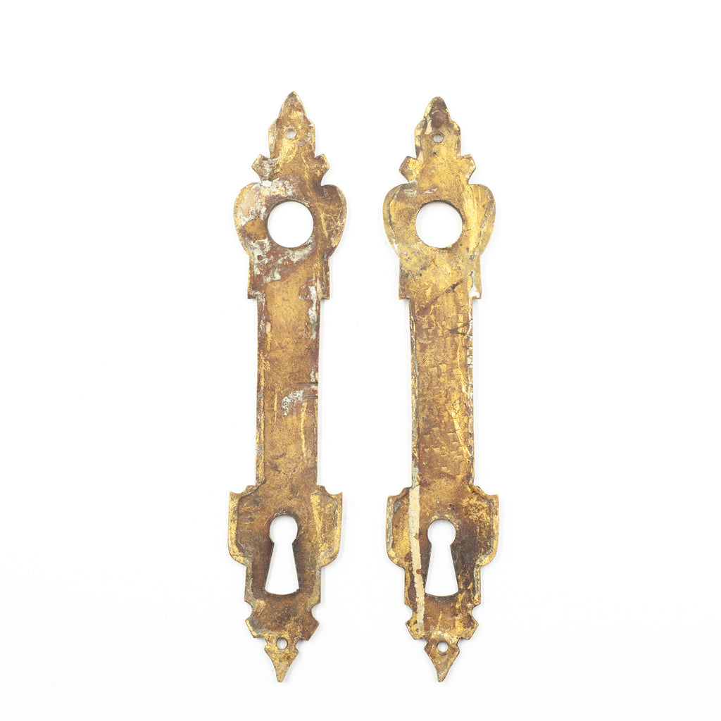 this is a picture of the backs of a pair of vintage antique brass escutcheons