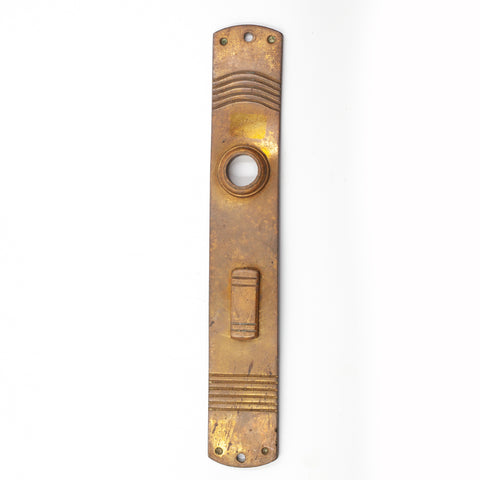 this is a slim vintage brass escutcheon with keyhole cover and a striped pattern