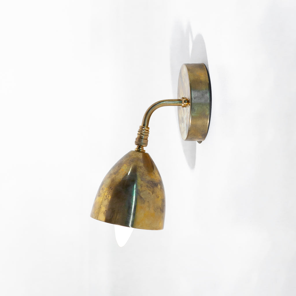 this is an antique brass wall sconce