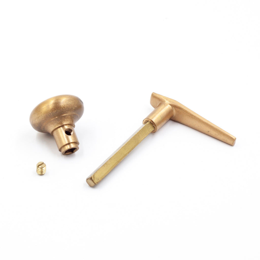 this photo is of a brass knob set for a french door disassembled